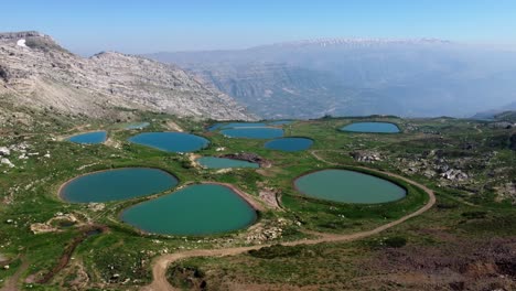 Beautiful-Mountains-And-Blue-Lakes-In-Aaquora,-Jbeil-Village,-Lebanon---Aerial-Shot