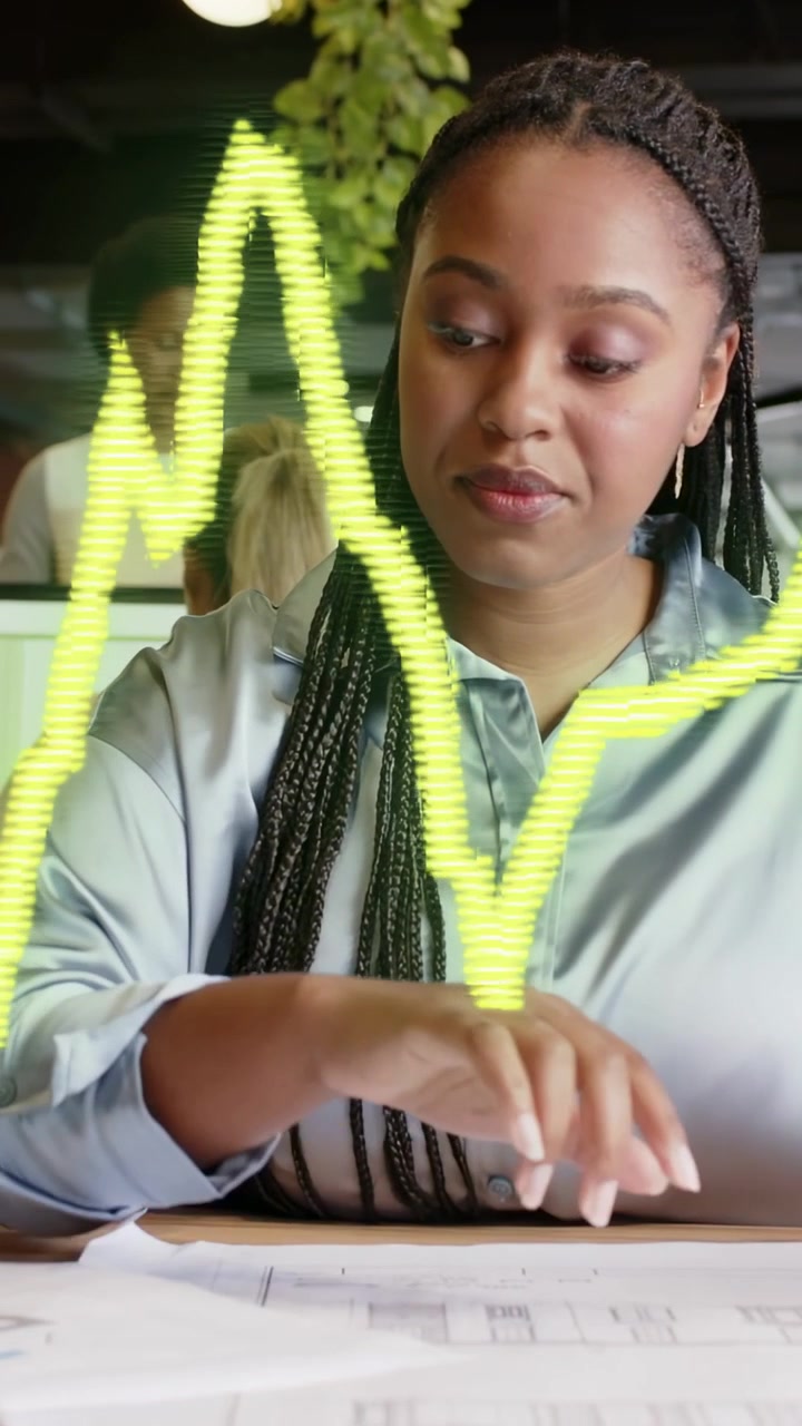 Vertical video: Female designer reviewing plans, neon zigzag graph appearing and covering front