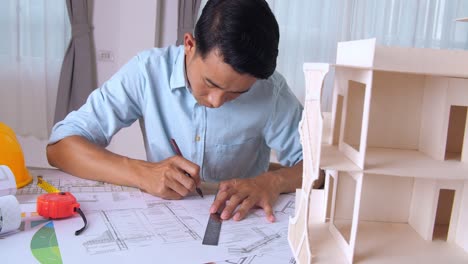 male architect working on a construction project in the office