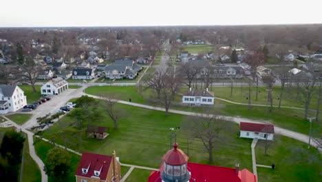 fort gratiot lighthouse in port huron, michigan with drone video moving forwards