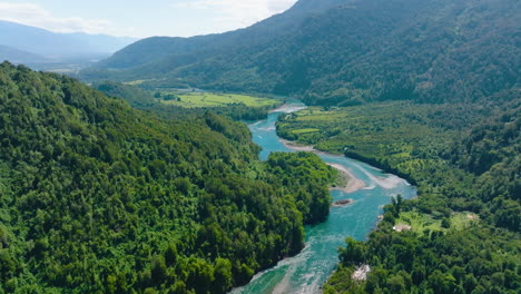 aerial view of puelo river meandering through lush forest lake district in chile