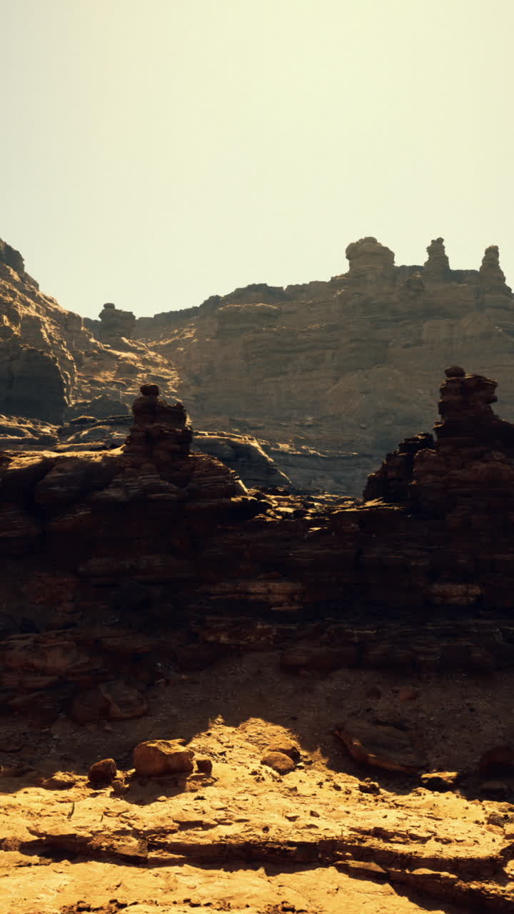 Unique rock formations under bright sun in an arid landscape