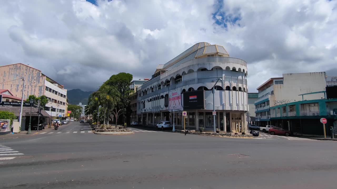 Street view in Papeete Tahiti, French Polynesia of quiet traffic on roads, buildings, and architecture in city centre