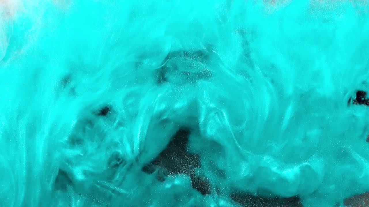 Abstract forms. Shooting on a black background. Mixing of paints