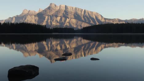 mount rundle and two jack lake with early morning mood and mountain reflection