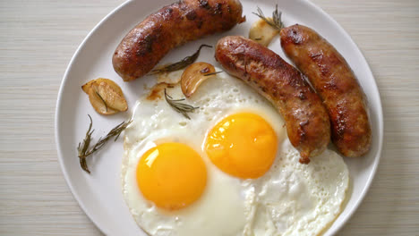 homemade double fried egg with fried pork sausage - for breakfast