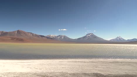 Salt-lagoon-near-volcanoes-in-the-middle-of-the-Atacama-Desert,-Chile,-South-America