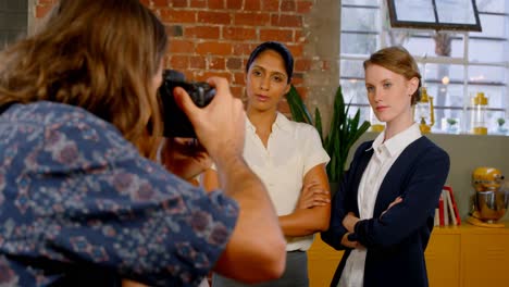 executive taking picture of colleagues on vintage camera 4k