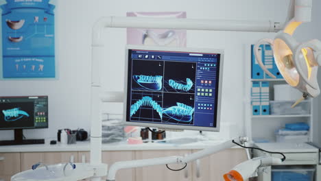 close-up of monitor with tooth radiography images on it i