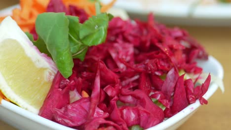 close up of a red cabbage salad with lemon and carrots