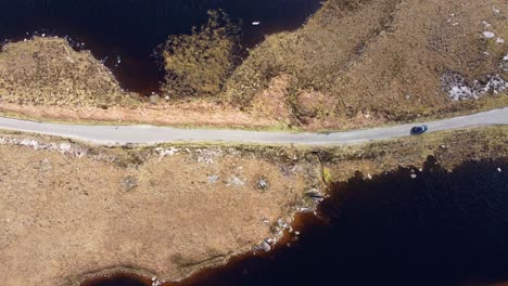 scenic drive between lochs - ariel shot - scotland