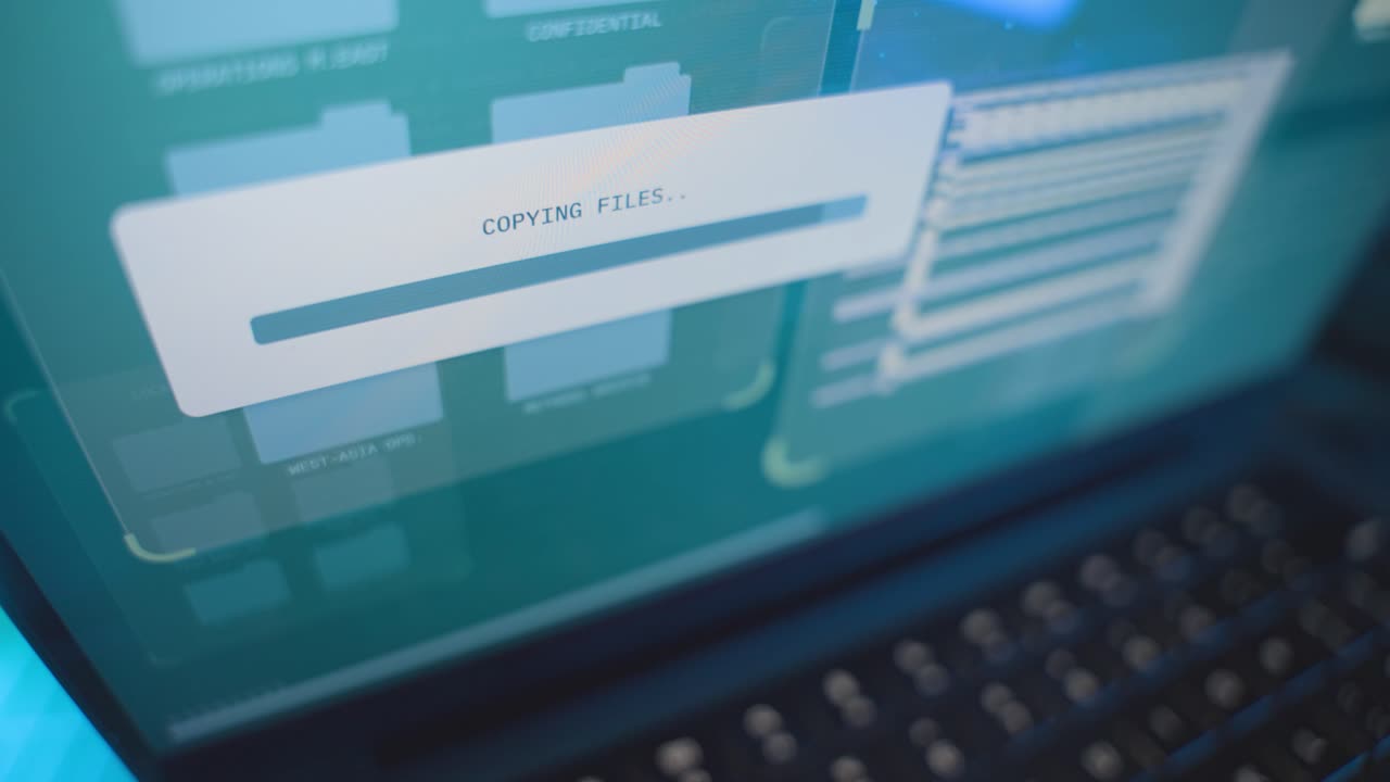 Close up on computer screen progress bar copying secret files from government server. Spy or hacker stealing information and sensitive data from agency or business. Folders being moved in cybercrime