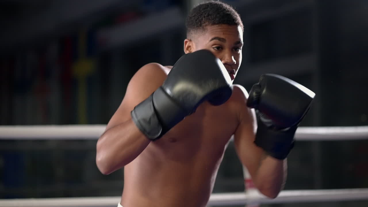 Young Boxer Training in the Ring