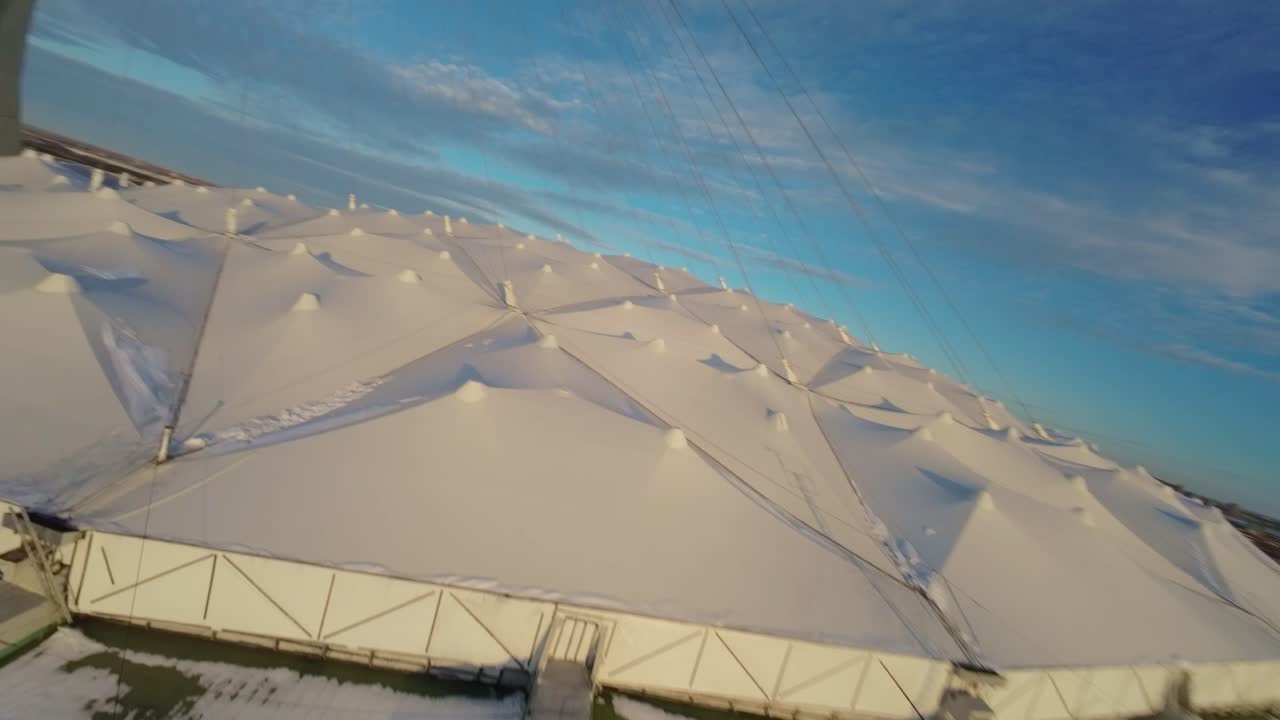 Aerial View of a Snow-Covered Stadium Roof