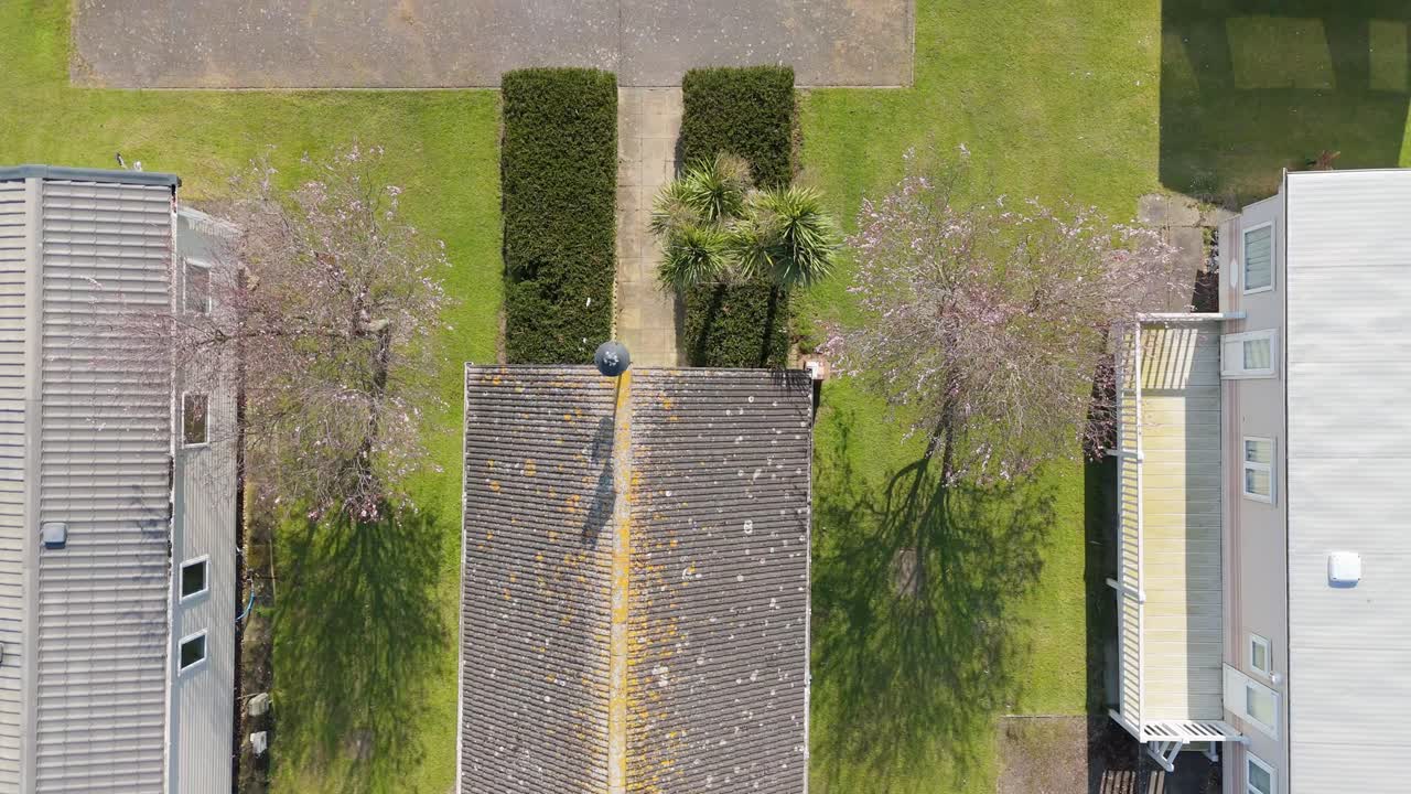 Warm light bathing the coastal holiday town of Skegness in Lincolnshire. Aerial views of hotels houses, theme parks and static holiday homes. Destination and tourist vacation, summer evening scene