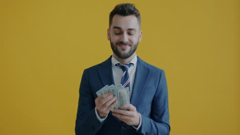 happy businessman receiving money
