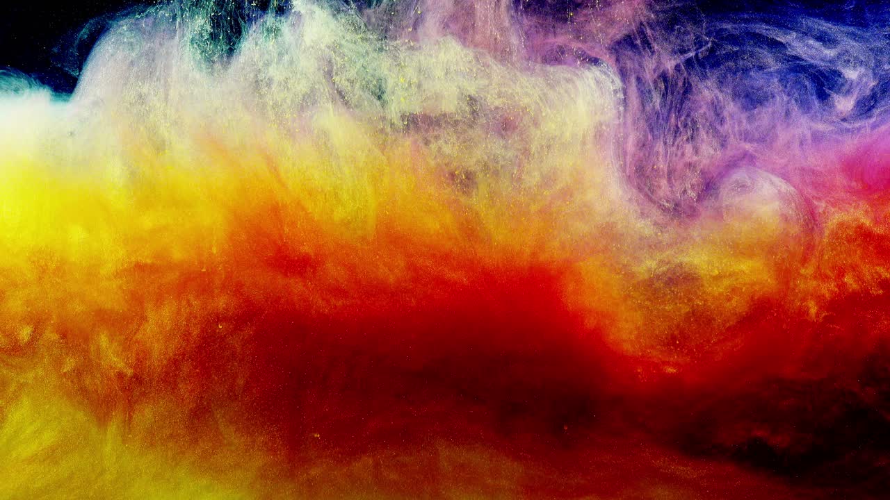 Colores de tinta vibrantes disolviéndose y extendiéndose en el agua