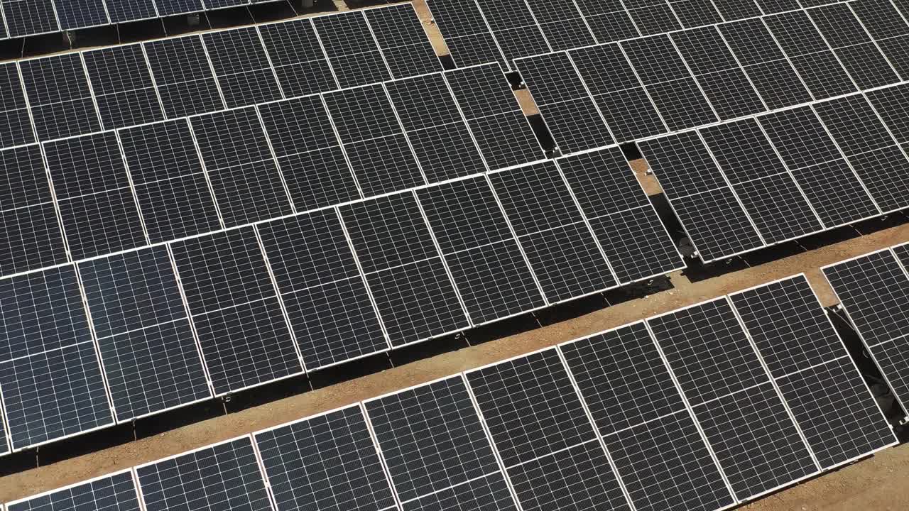 Solar farm with Photovoltaic Panels Converting solar power to electricity. Green energy.4k video