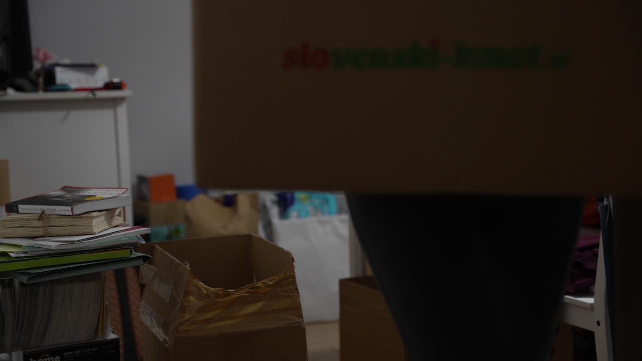 Simple blonde woman packing things for moving out to new house