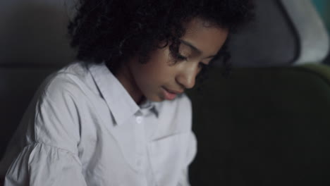 Girl-writing-down-note-in-diary-close-up.-African-american-child-holding-pen.