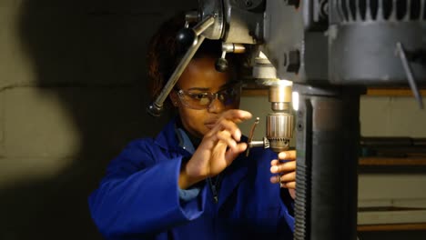 female worker working in glass factory 4k