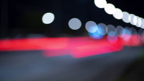 loop able time lapse of night traffic lights in city. beautiful bokeh in dark blurry background at night. uhd, 4k