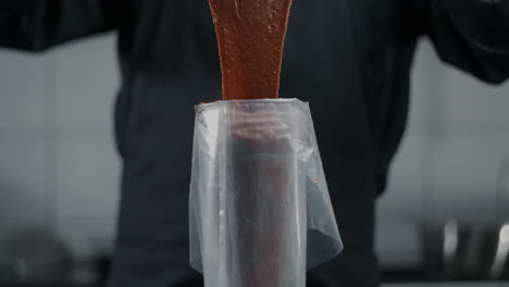 chef piping chocolate mixture