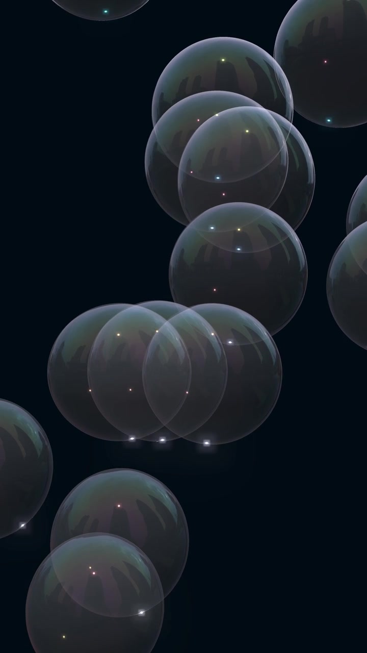 Translucent iridescent soap bubbles drift slowly upwards against a dark background in vertical orientation