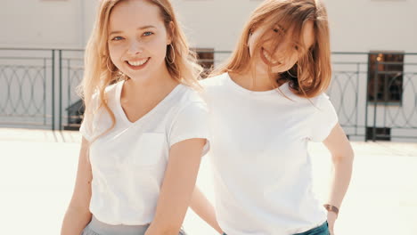 two young women posing outdoors