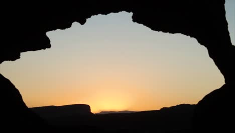 sunset view through rock arch