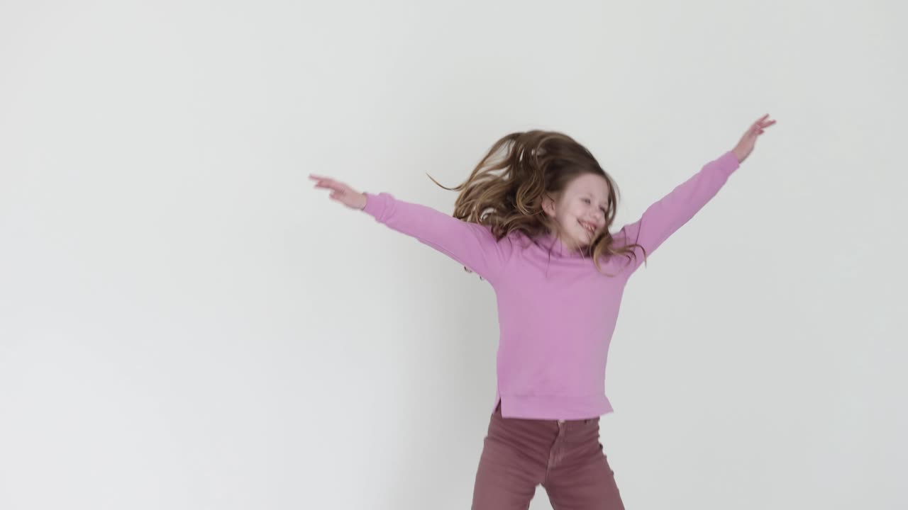 Girl jumping in studio