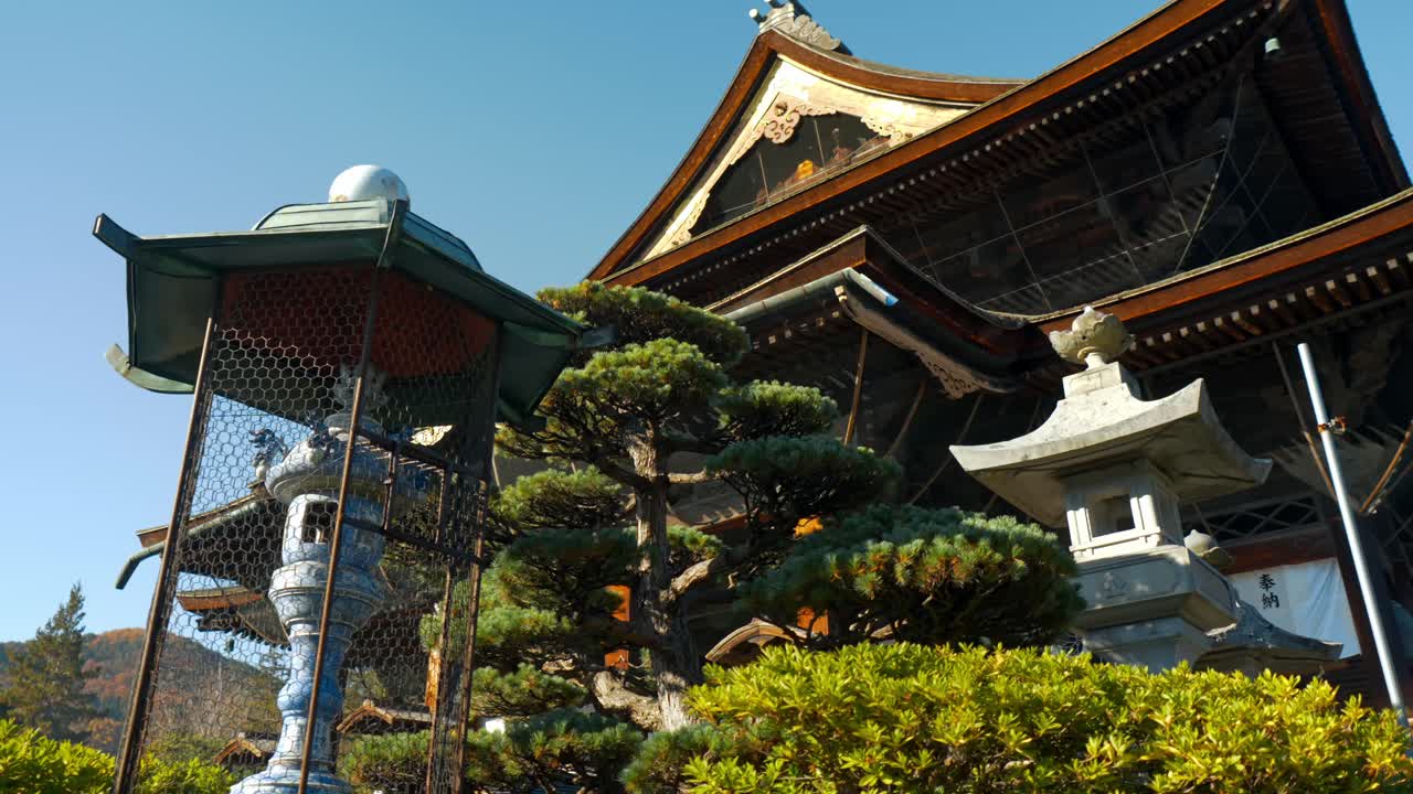 A serene and beautiful view of a traditional Japanese temple nestled in Nagano, Japan.