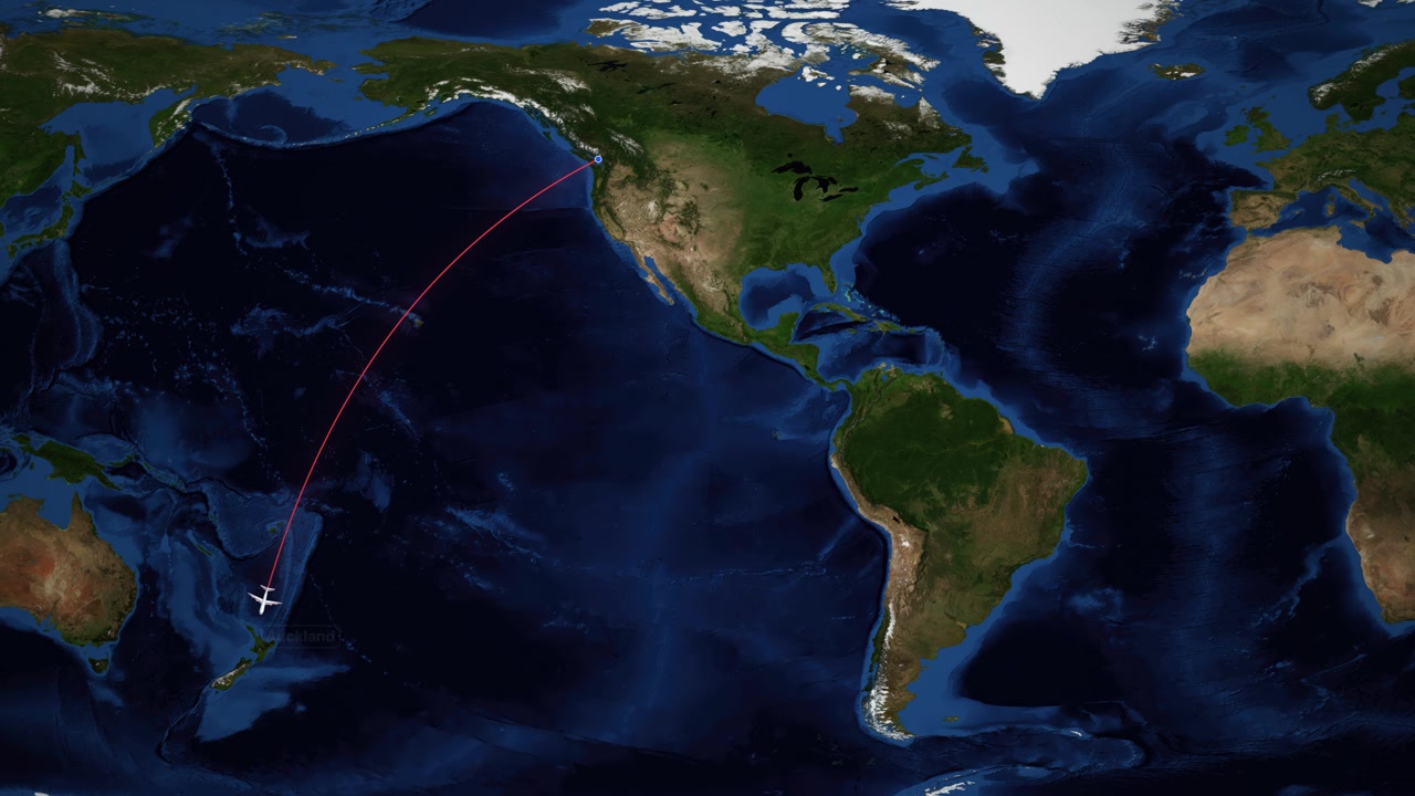 A white airplane icon follows a red arc across a world map over the Pacific