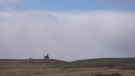 Time-lapse-shot-of-clouds-above-a-small-Icelandic-church-or-chapel-in-the-vast-open-spaces-of-Iceland