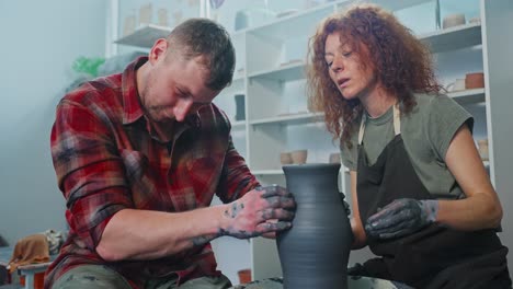 pottery workshop: couple learning to make pottery