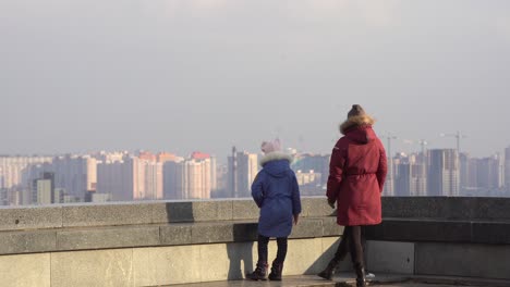 mother daughter on top of the roof in autumn