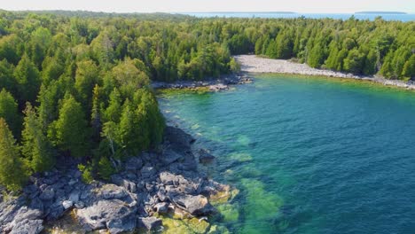 wild nature with forest and lake water in ontario, canada, aerial view