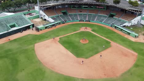 aerial drone view of a baseball stadium, minor league youth training, sportsman in dominican republic