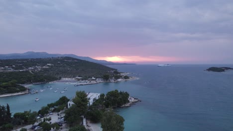 aerial panoramic view of the scenic turquoise coastline of ksamil during sunset, albania