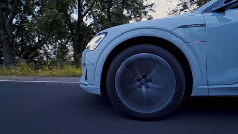 Audi E-Tron first all-electric SUV car. Presentation of a new car model. Fast driving drifting in city