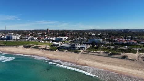 aerial orbit of cronulla beach and shoreline with soft waves and open ocean, sydney nsw australia