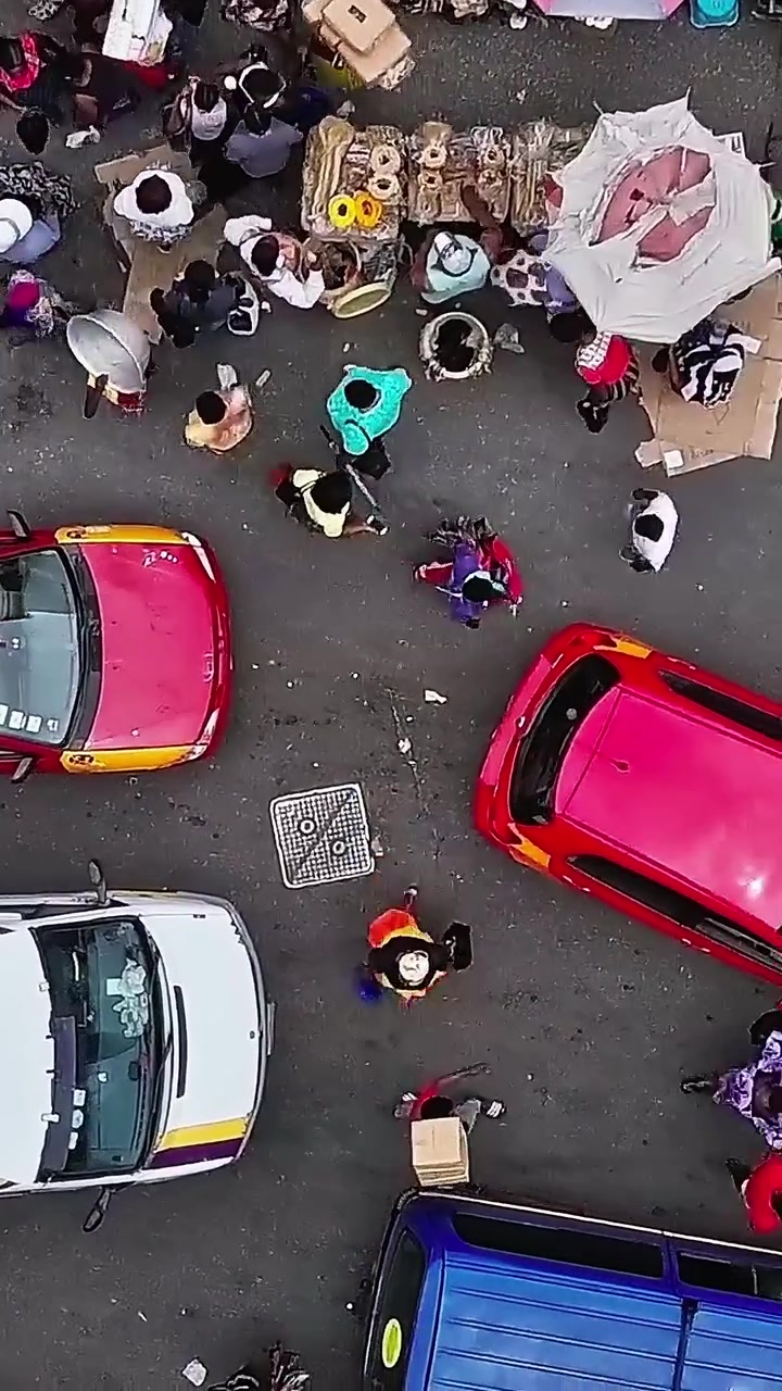 Market activity in Accra Ghana with cars and people interacting
