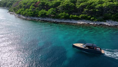 luxury yacht cruising in clear turquoise waters near lush pakleni islands, croatia