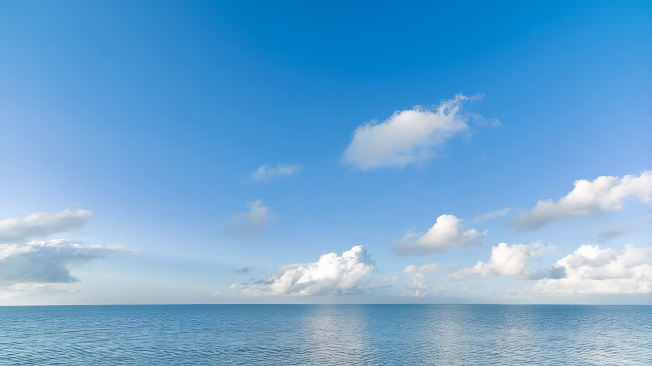 Calm Blue Ocean and Sky with Clouds