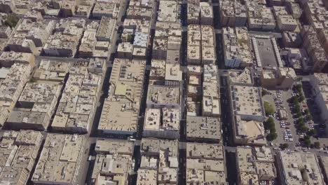 Birds-eye-view-of-traffic-cars-in-Khobar-sweikit-city-and-Khobar-skyline-and-corniche-visible