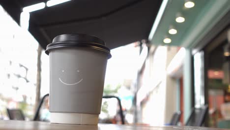 coffee cup on a table in outdoor cafe