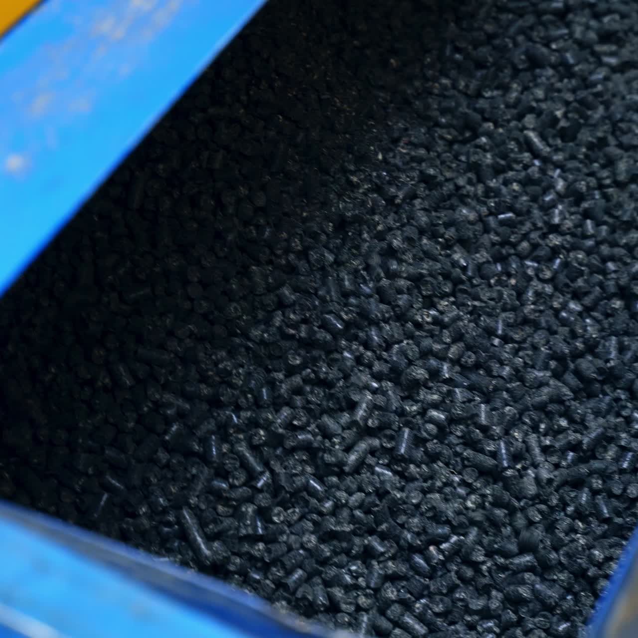 Compressed pellets for use as an eco-friendly renewable. Close up on a pile of compressed pellets for use as an eco-friendly renewable
