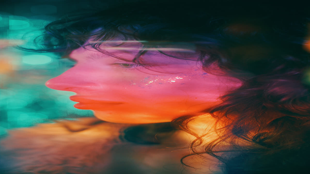 Portrait of Young Attractive Woman with Glitter Makeup behind Bokeh Lights