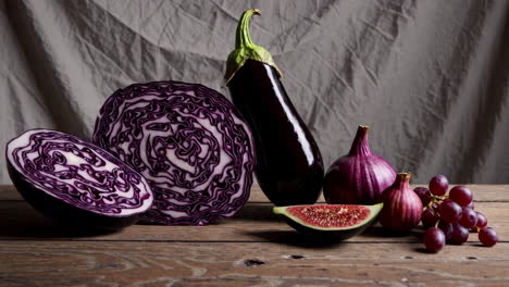 still life of purple vegetables and fruits