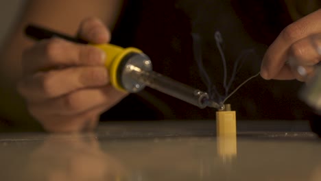 Man-Solders-the-Connectors,-Hands-soldering-wires-close-up